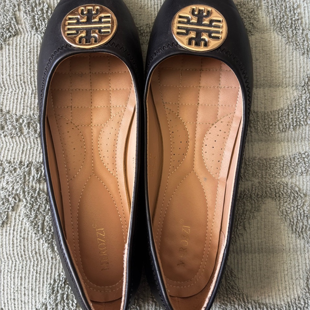 Black Flats with Gold Emblem